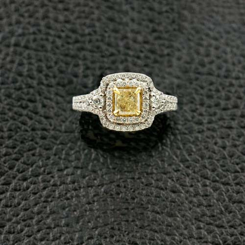 Radiant Yellow Diamond Ring with a Double Halo